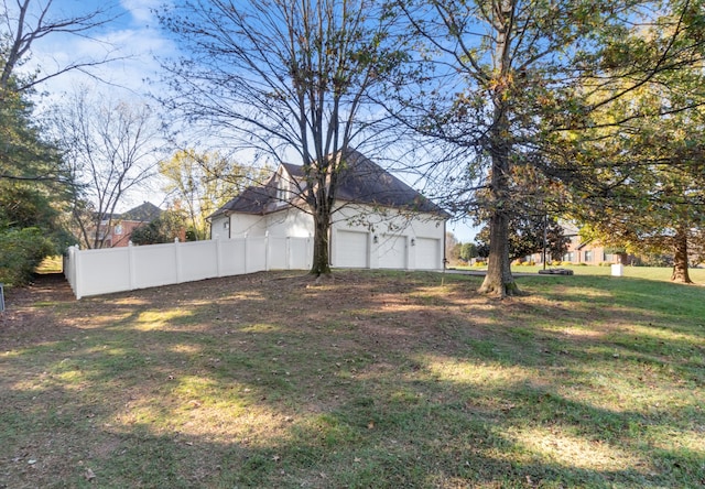 view of yard featuring a garage