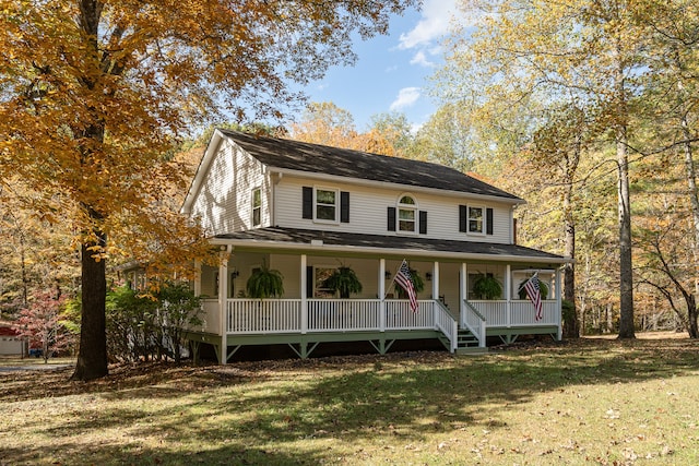 farmhouse inspired home featuring a porch and a front yard