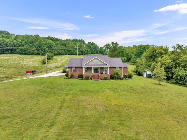 ranch-style home with a porch and a front lawn