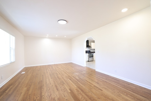 unfurnished living room with light hardwood / wood-style flooring