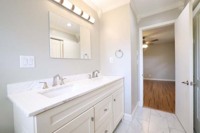 bathroom featuring vanity, ceiling fan, ornamental molding, and wood-type flooring