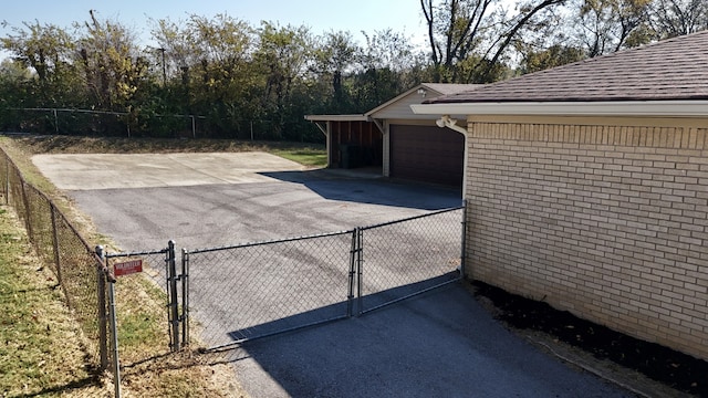 view of patio featuring an outdoor structure and a garage