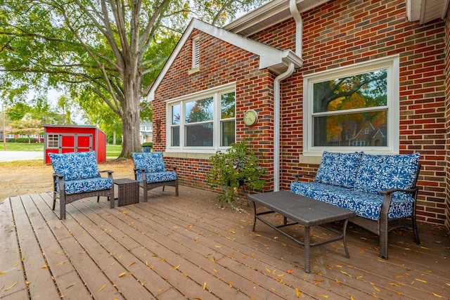 wooden deck featuring a shed