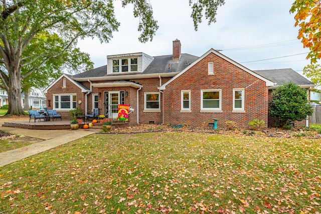 view of front of home featuring a front lawn and a deck