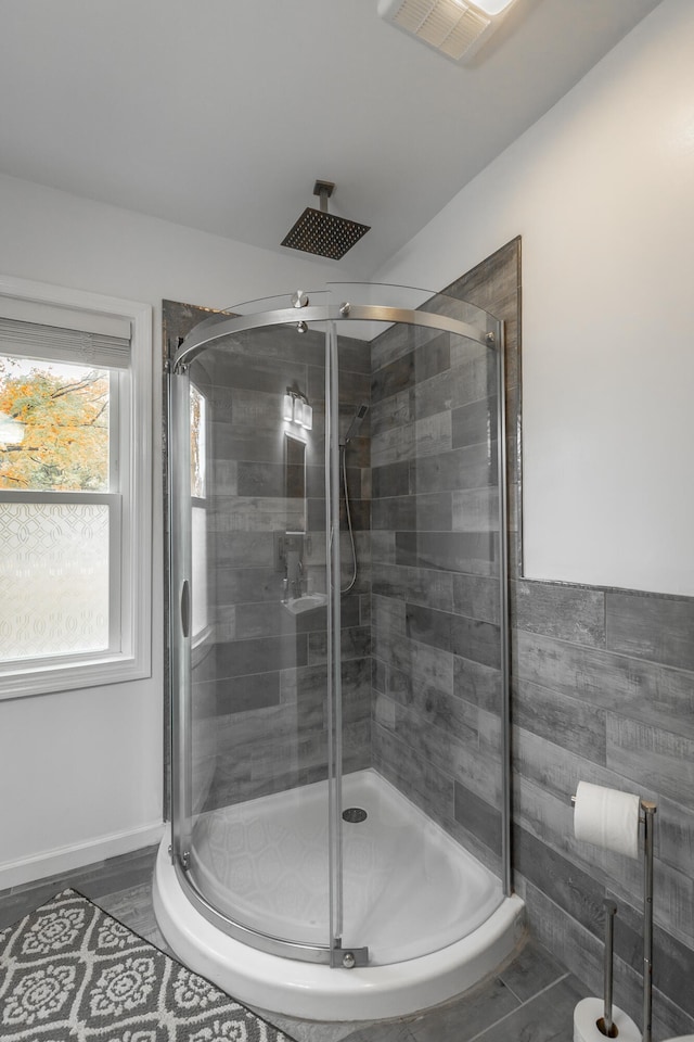 bathroom with a shower with shower door