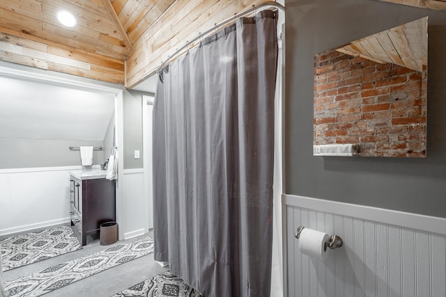 bathroom with vanity, lofted ceiling, and wooden ceiling