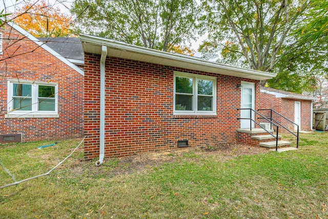 view of home's exterior with a lawn