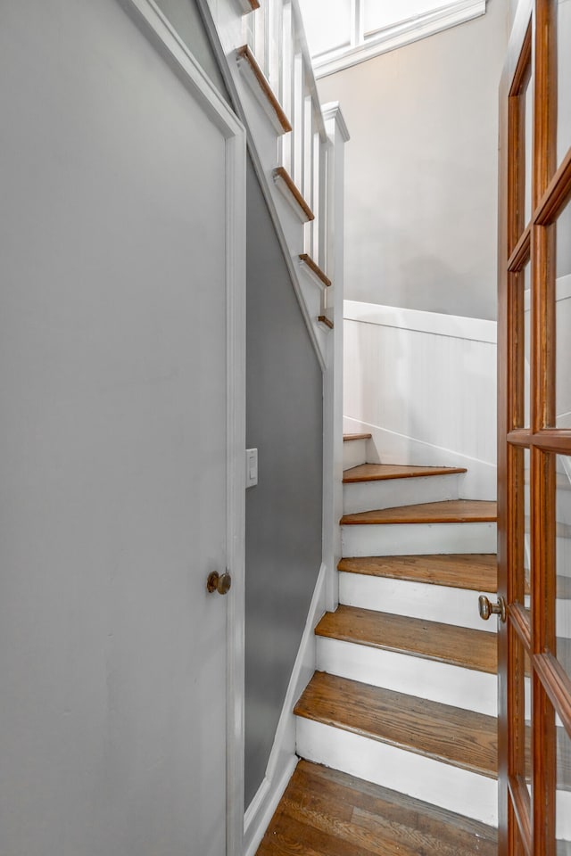 stairs with hardwood / wood-style floors