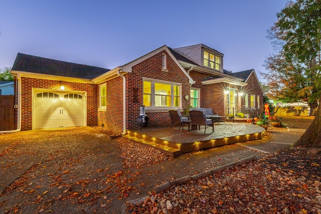 view of front of home featuring a deck and a garage