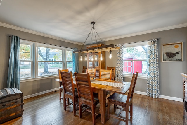 dining area with crown molding and dark hardwood / wood-style floors