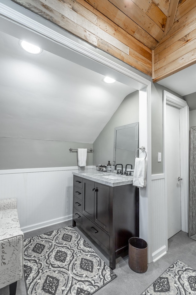 bathroom with vanity, lofted ceiling, and wooden ceiling