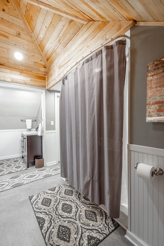 bathroom with shower / bath combination with curtain, wood ceiling, vaulted ceiling, and vanity