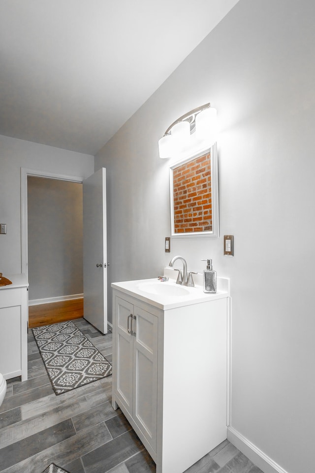 bathroom featuring vanity and hardwood / wood-style floors