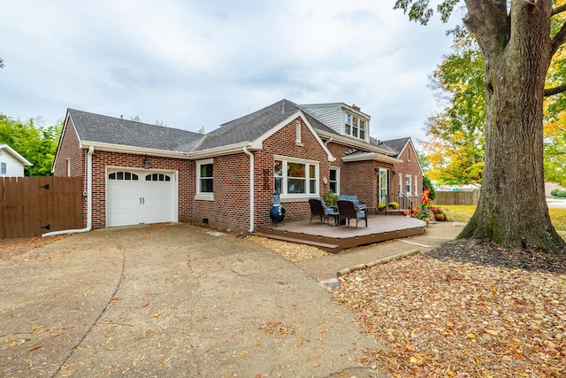 view of front facade with a deck and a garage