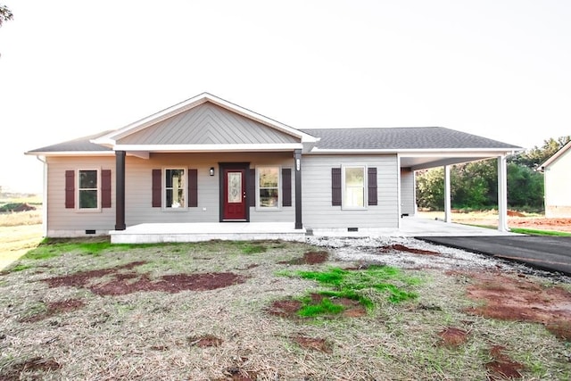 ranch-style home featuring a carport