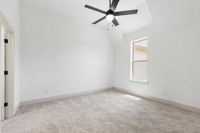 spare room with light carpet, lofted ceiling, and ceiling fan