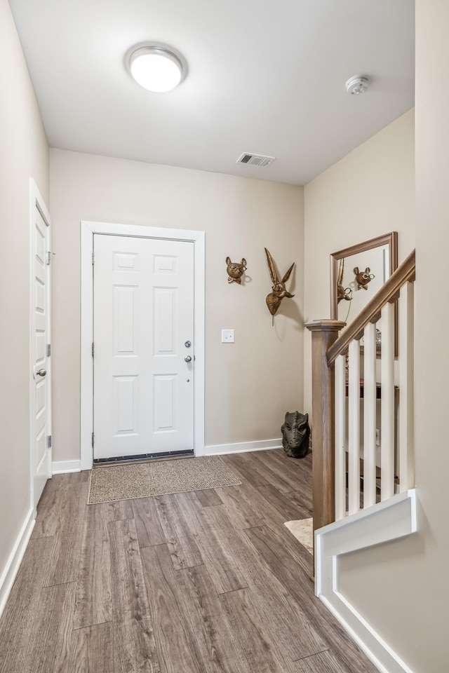 entrance foyer featuring hardwood / wood-style floors