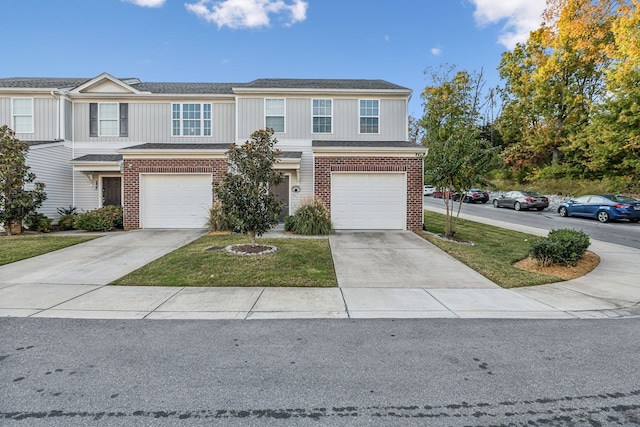 view of front of property with a front lawn and a garage