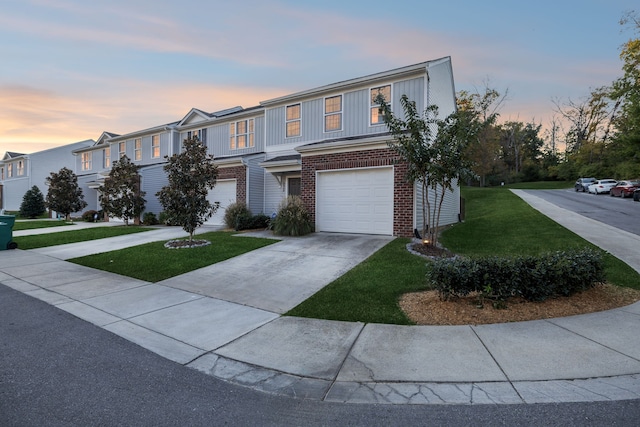 view of front of home featuring a yard and a garage