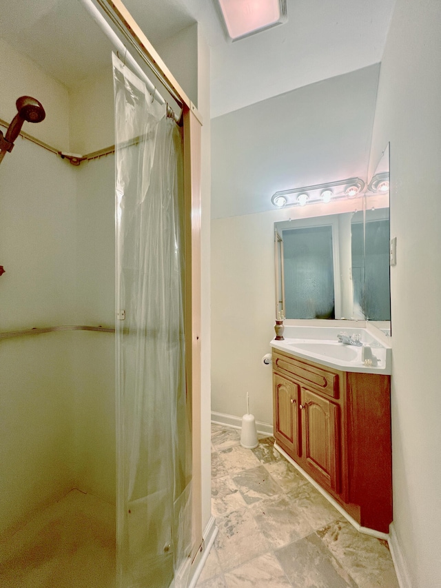 bathroom featuring vanity and walk in shower