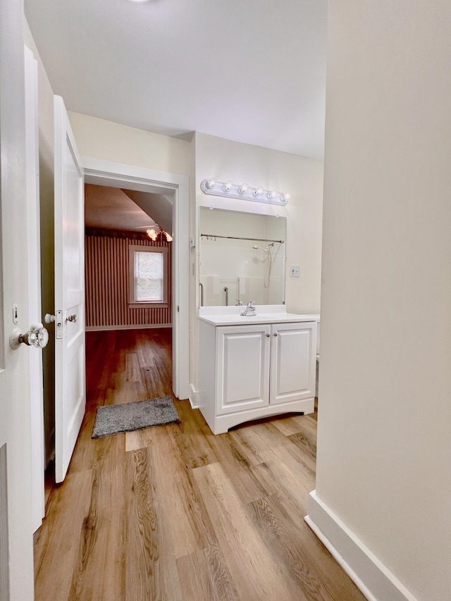 bathroom with vanity and hardwood / wood-style flooring