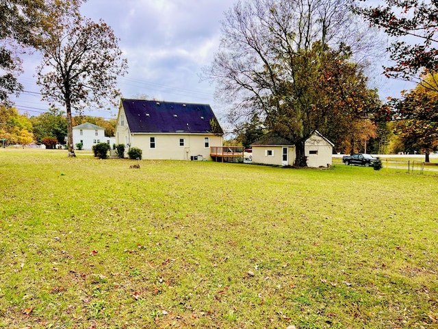 view of yard with a wooden deck