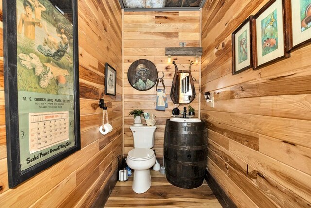 700 Kincaid Rd, Minor Hill, TN 38473 - bathroom featuring wooden walls, toilet, and wood finished floors