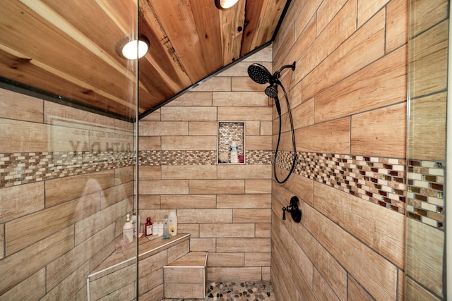 bathroom featuring walk in shower, wooden ceiling, and wood walls