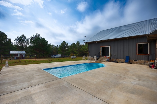 view of swimming pool featuring a patio