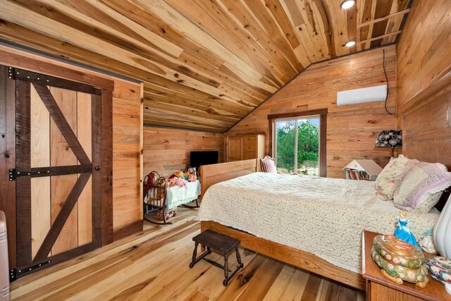 700 Kincaid Rd, Minor Hill, TN 38473 - bedroom with vaulted ceiling, wood walls, and wood finished floors