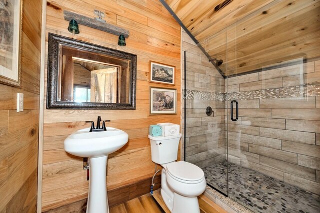 700 Kincaid Rd, Minor Hill, TN 38473 - bathroom featuring wooden walls, toilet, a shower stall, lofted ceiling, and wood ceiling