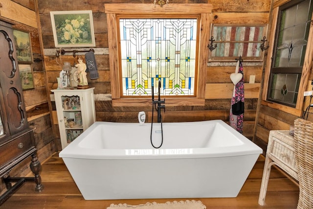 700 Kincaid Rd, Minor Hill, TN 38473 - full bathroom featuring wooden walls, a freestanding bath, and wood finished floors