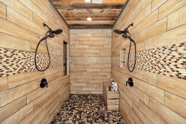 bathroom featuring tiled shower and wooden ceiling