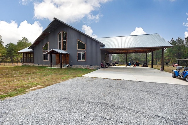 700 Kincaid Rd, Minor Hill, TN 38473 - view of front facade featuring crawl space, driveway, metal roof, a front yard, and an attached carport