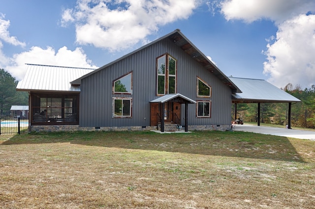 modern farmhouse style home featuring a carport, a front lawn, and a swimming pool