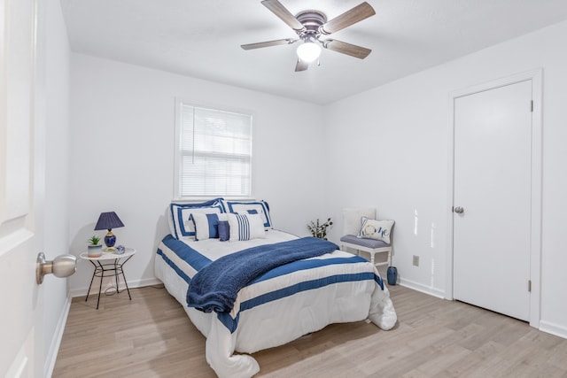 bedroom with light wood-type flooring and ceiling fan