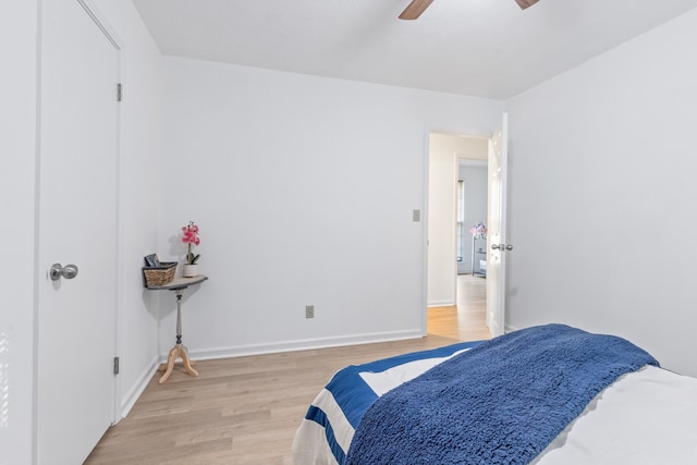 bedroom with light wood-type flooring and ceiling fan