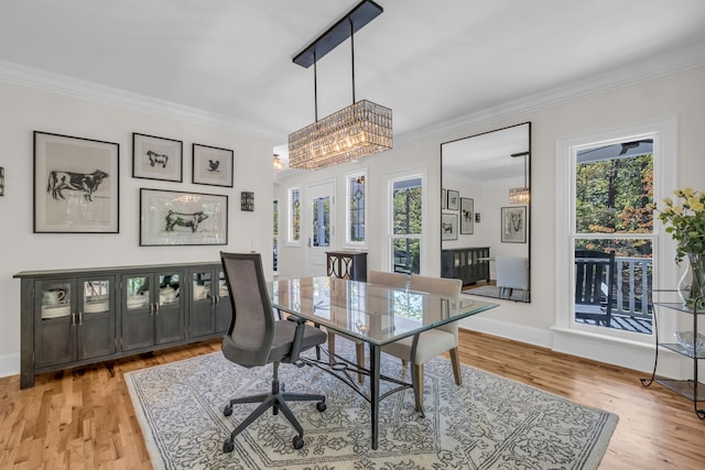 office space with ornamental molding and light wood-type flooring