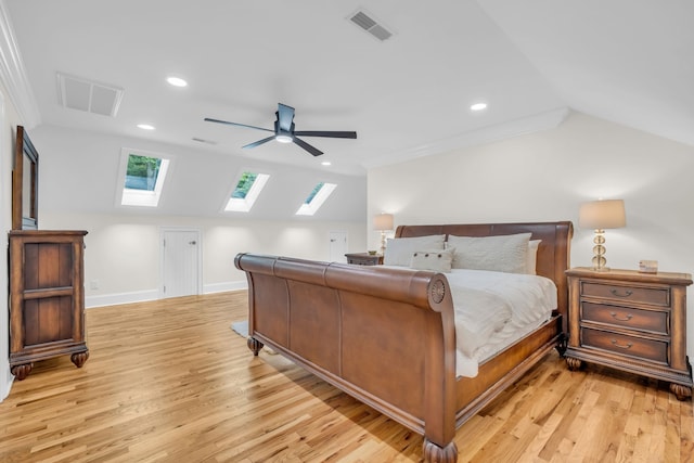 bedroom with lofted ceiling, ornamental molding, light wood-type flooring, and ceiling fan