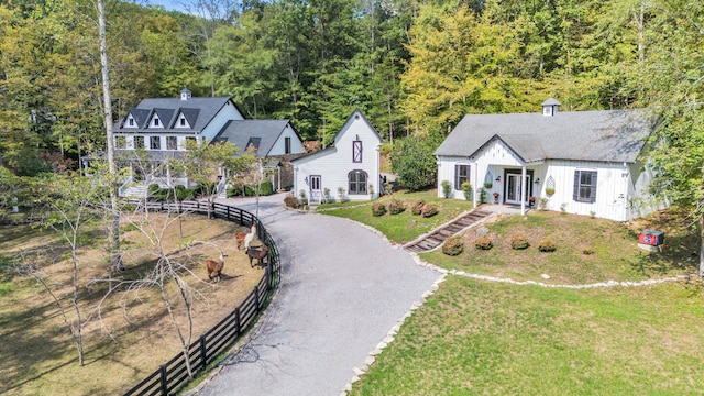 view of front of home featuring covered porch and a front lawn