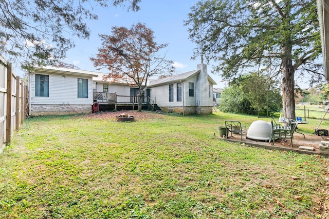 view of yard featuring a wooden deck