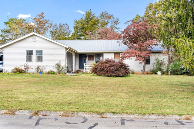 ranch-style house featuring a front lawn