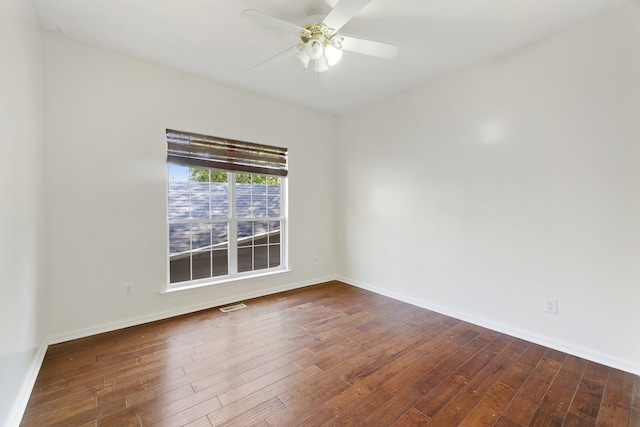 empty room with ceiling fan and hardwood / wood-style flooring