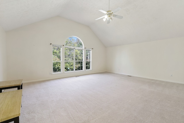 bonus room with lofted ceiling, a textured ceiling, light colored carpet, and ceiling fan