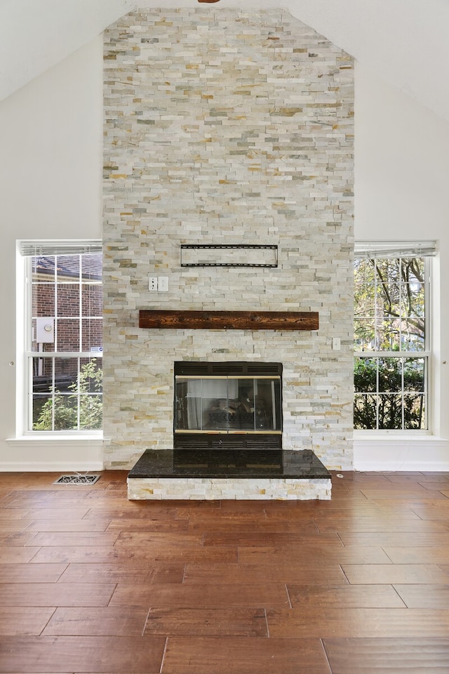 details with hardwood / wood-style floors and a fireplace