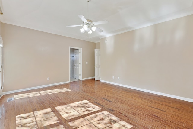 unfurnished room featuring light hardwood / wood-style floors, crown molding, and ceiling fan