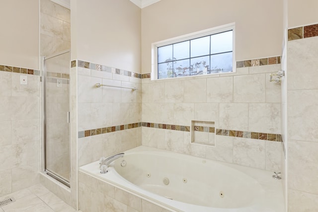 bathroom featuring independent shower and bath