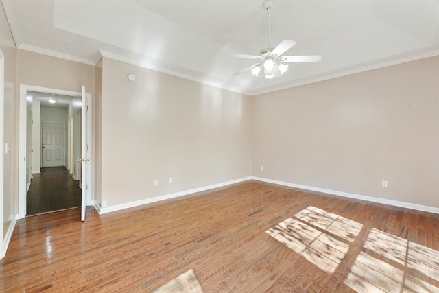 unfurnished room with ceiling fan, ornamental molding, and hardwood / wood-style floors