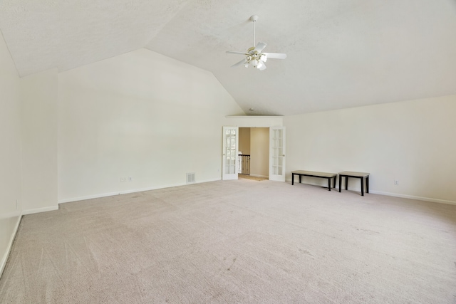 bonus room featuring lofted ceiling, light carpet, and ceiling fan