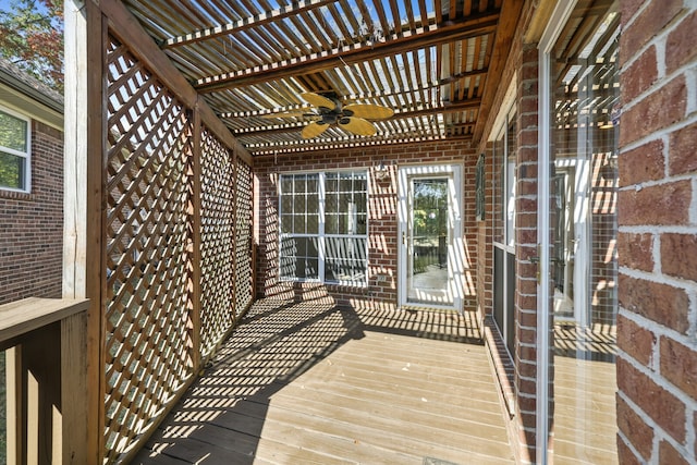 deck with a pergola and ceiling fan